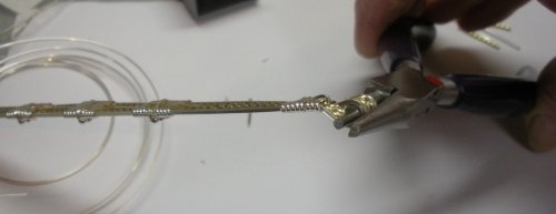 Judy Larson's Two-tone Beaded Bangle - , Classic Wire Jewelry, Wire Wrapping, Wrapping, Wire Wrapping Jewelry, Curl the 6 square wires on each side of the bangle ends towards the back (inside) of the bangle.